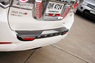 Накладка на задний бампер с повторителями стоп сигнлов на Toyota Fortuner 2012